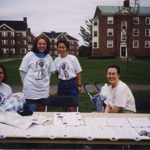 A photo of four women on Colby Cares Day 1998 from the Colby Volunteer Center's scrapbook.