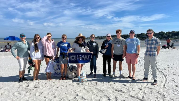 Volunteers in Gloucester, Mass., clean up a beach as part of Colby Alumni Day of Service 2025.