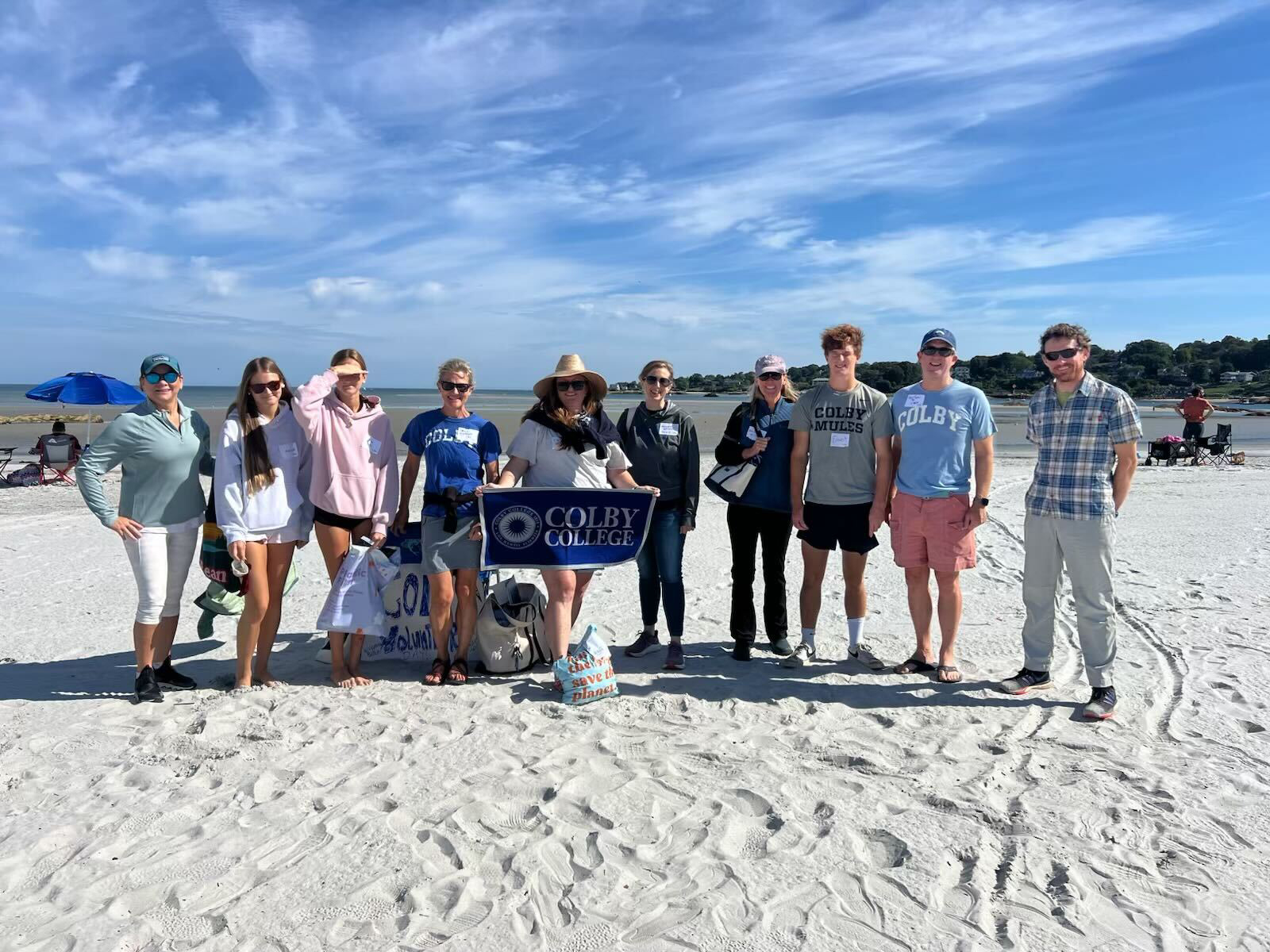 Volunteers in Gloucester, Mass., clean up a beach as part of Colby Alumni Day of Service 2025.