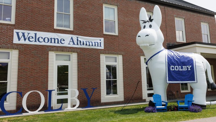 'Colby' and 'Welcome Alumni' signs, plus the Colby inflatable mule, greet Reunion 2025 attendees.