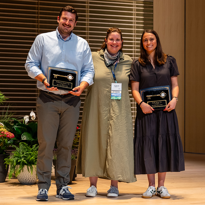 2026 Blue Key Award recipients William J. Parker ’16 (left) and Holly Bogo ’16 (right) pose with Catherine Mullin ’11 (center), chair of the award selection committee.
